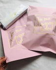pink custom poly mailers with gold logo