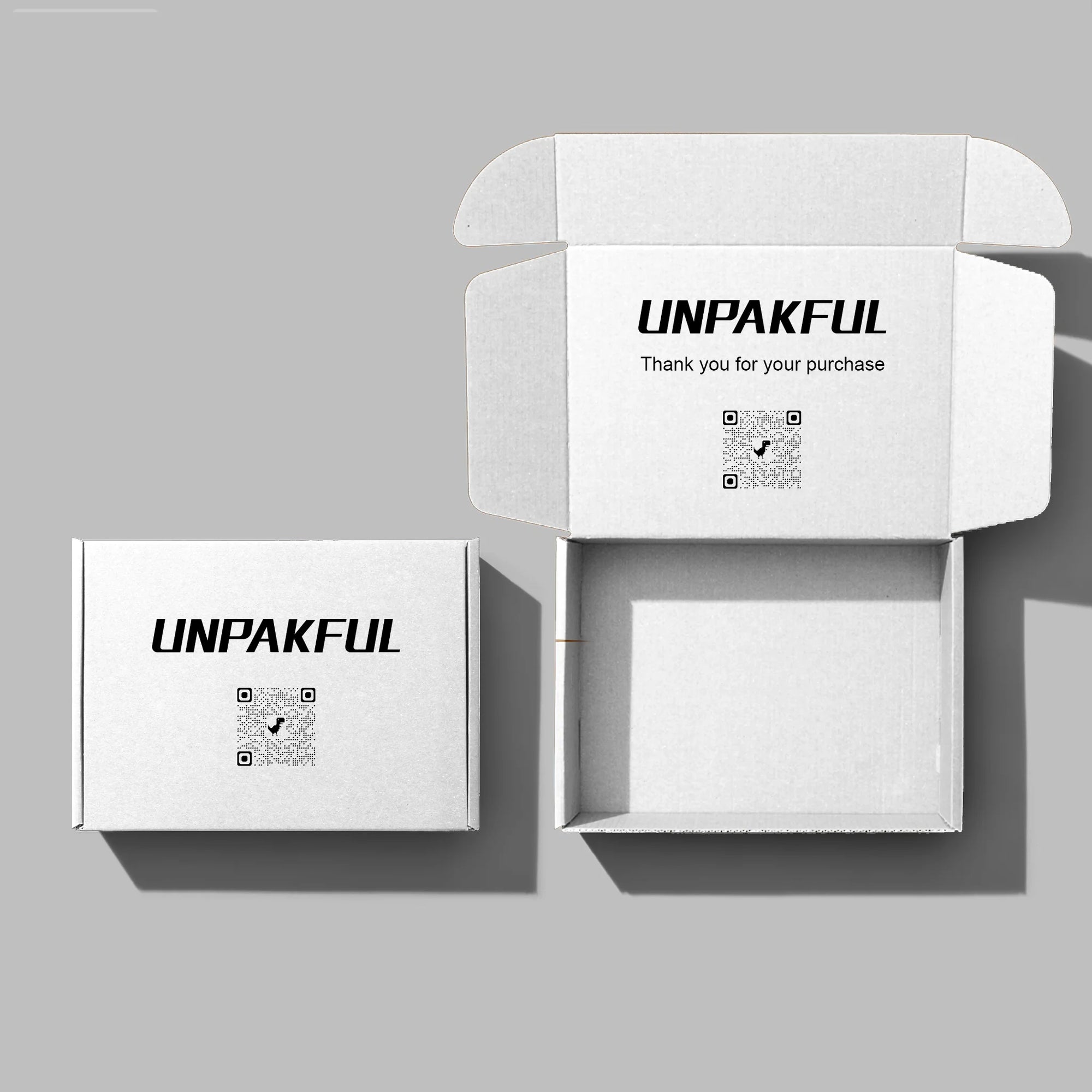 Custom mailer box set with UNPAKFUL branding, showcasing open and closed designs for packaging solutions.