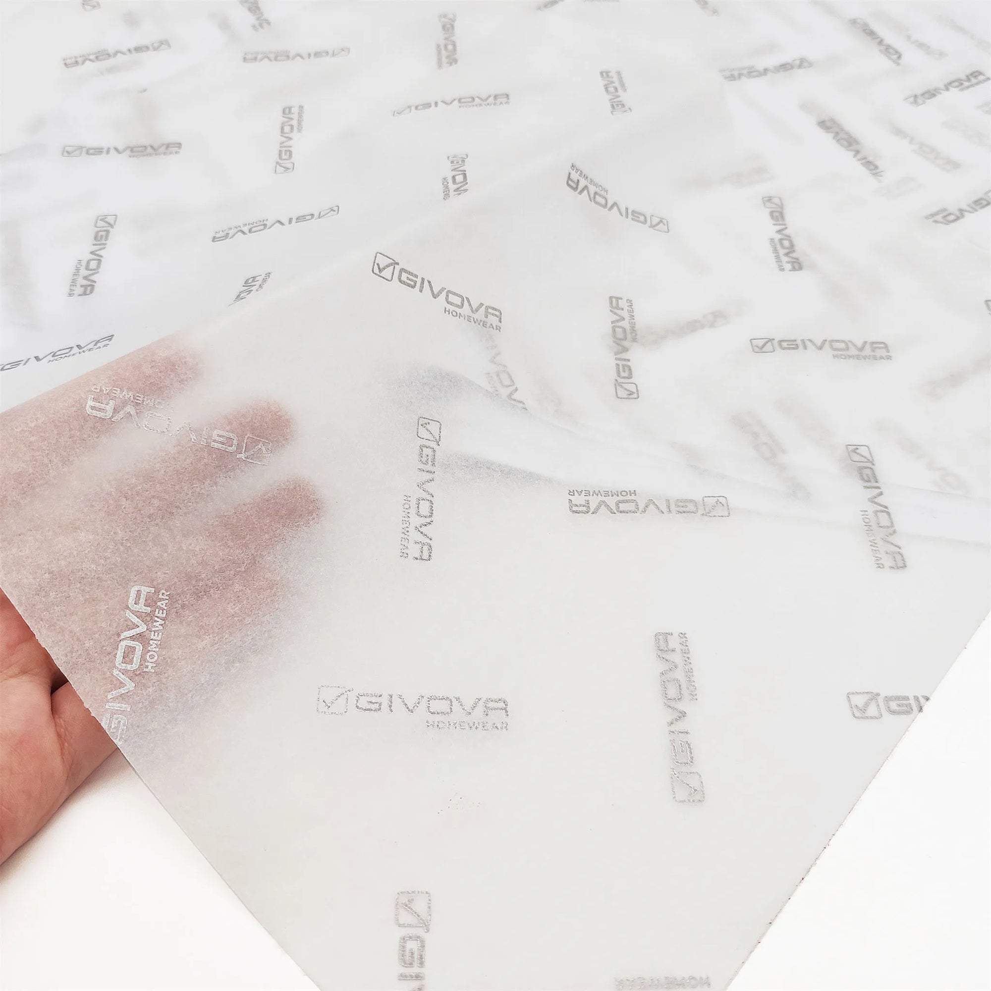 Custom tissue paper featuring Givova logo, showcasing elegance and brand identity for premium packaging.